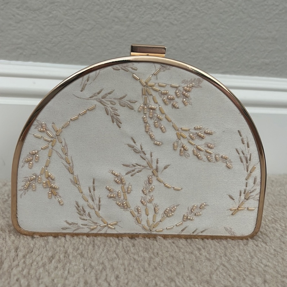 a new day half moon beaded clutch